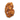 A raw, organic-shaped gold nugget with embedded pinkish-brown mineral inclusions, isolated on a clean white background.